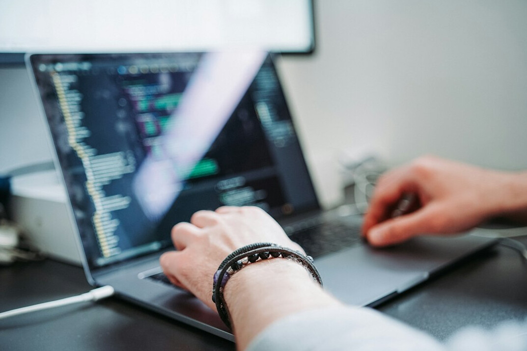 person learning to code on laptop