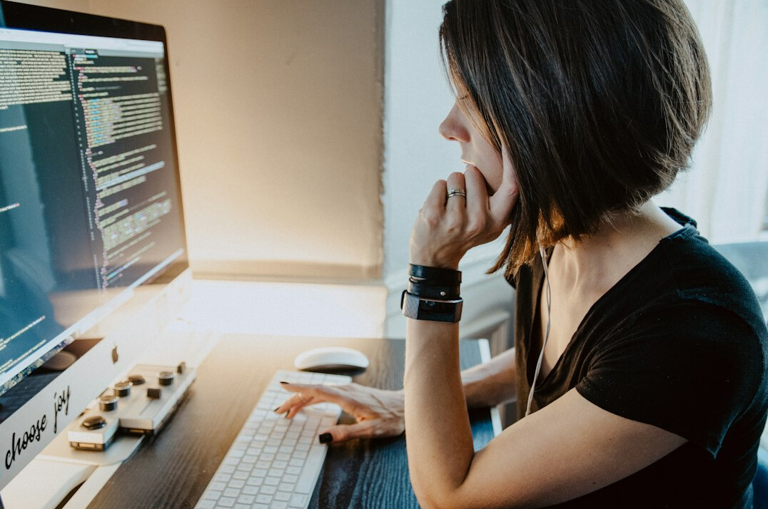 successful developer at desk